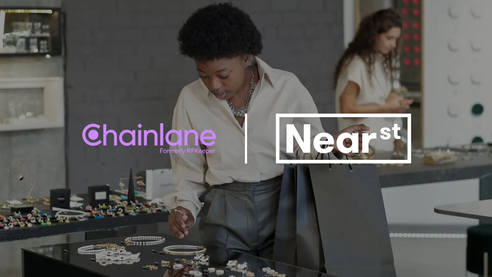 Chainlane and NearSt logos over a shopper browsing jewellery in a store