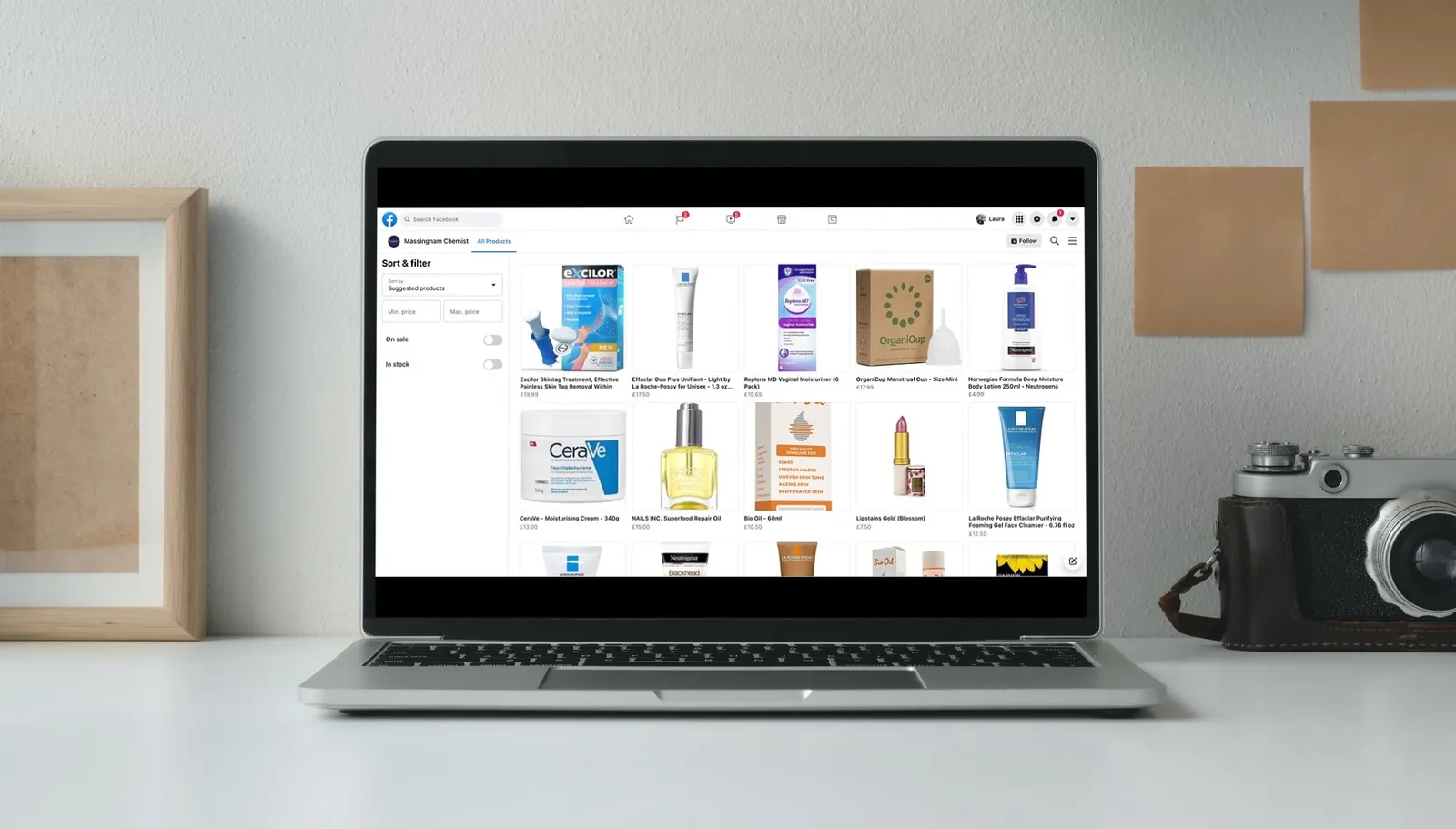 Laptop showing Massingham Chemist's Facebook Shop with health and beauty products